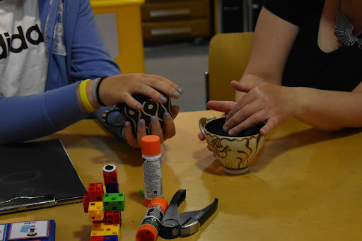 Children's hands working with clay