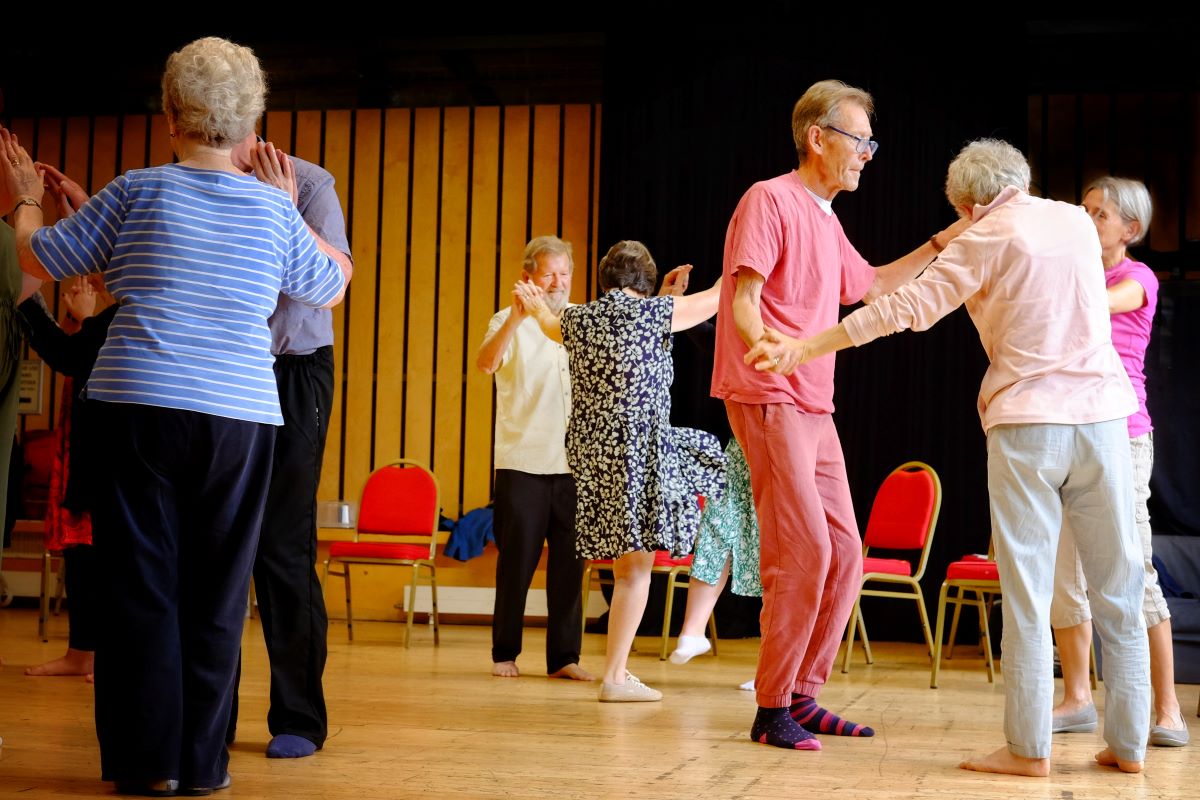 People dancing in small groups