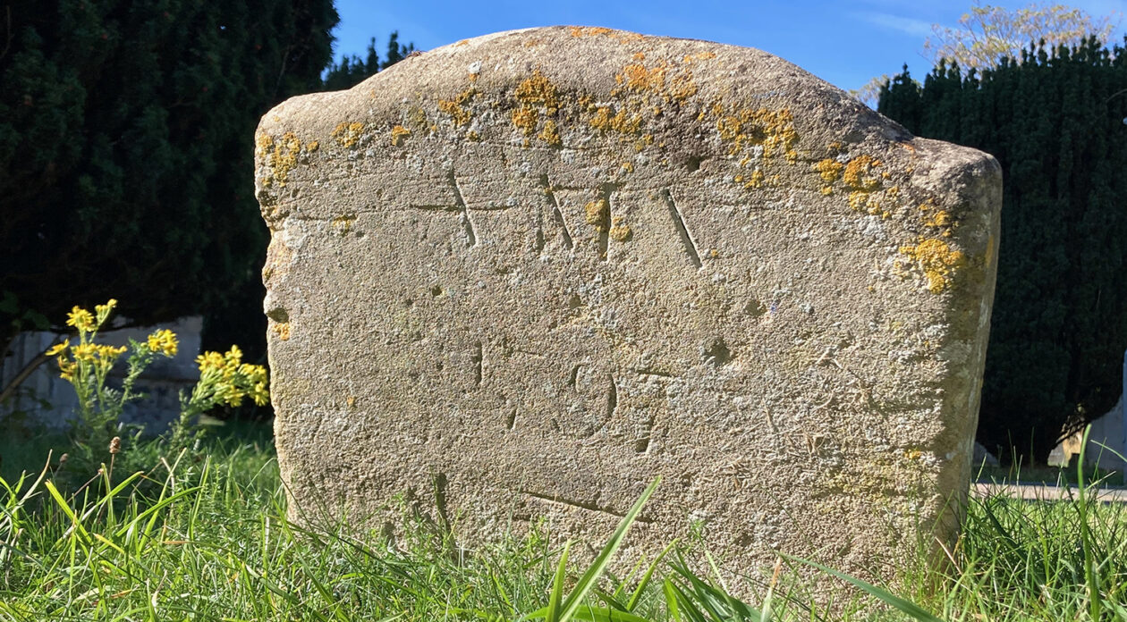 The recently rediscovered footstone marking the grave of Anna Maria Vassa, inscribed ‘A M V / 1797’ in St Andrew’s Churchyard, Chesterton.