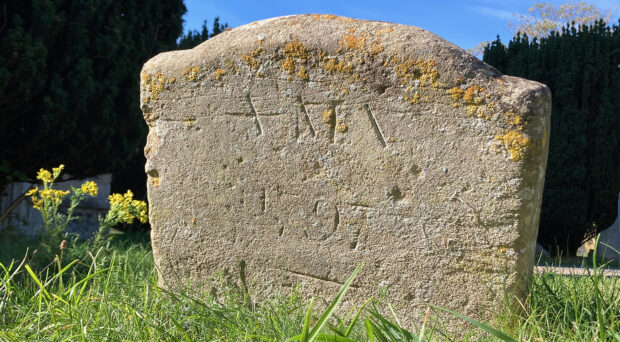 The recently rediscovered footstone marking the grave of Anna Maria Vassa, inscribed ‘A M V / 1797’ in St Andrew’s Churchyard, Chesterton.