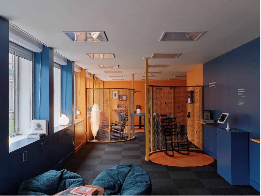 The Rise Up Reflection Space featuring seating booths, beanbags, books and soft lighting from lamps.