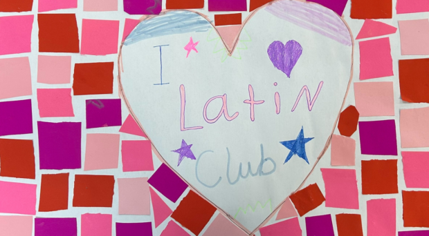 A child-made paper mosaic which reads ‘I love Latin club’.