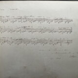 A sheet of music with handwritten notes.