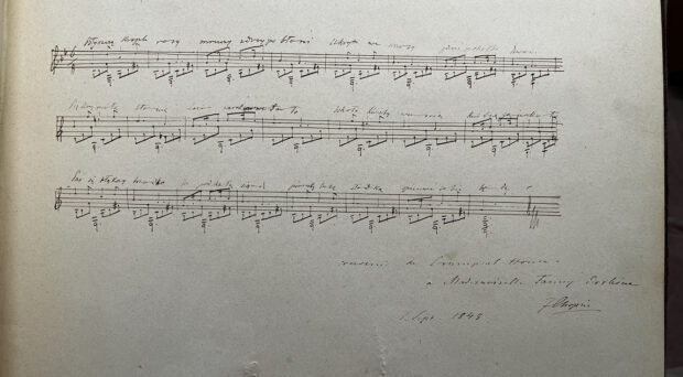 A sheet of music with handwritten notes.
