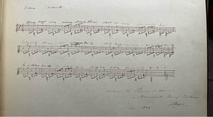 A sheet of music with handwritten notes.