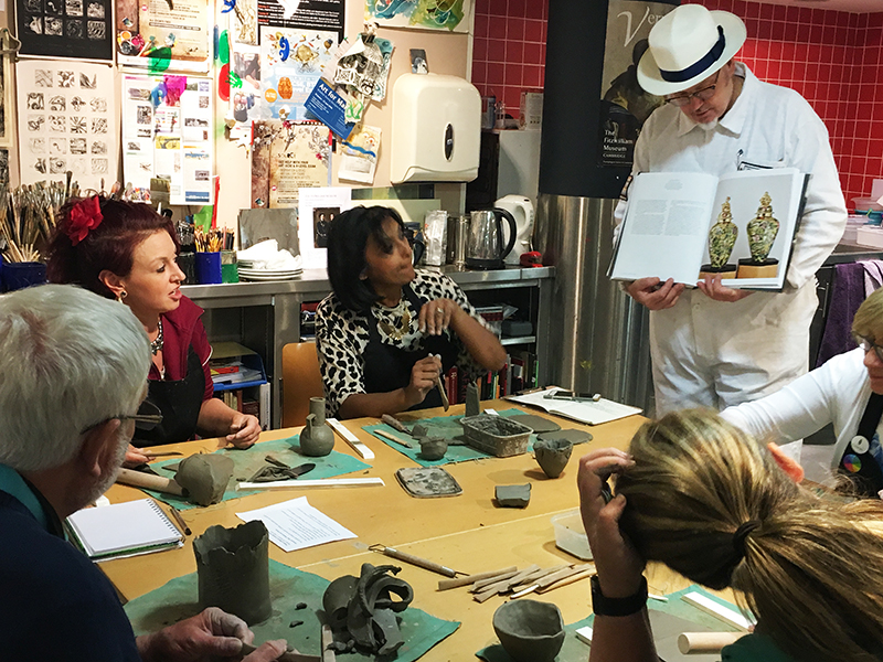 Participants working with clay in the studio