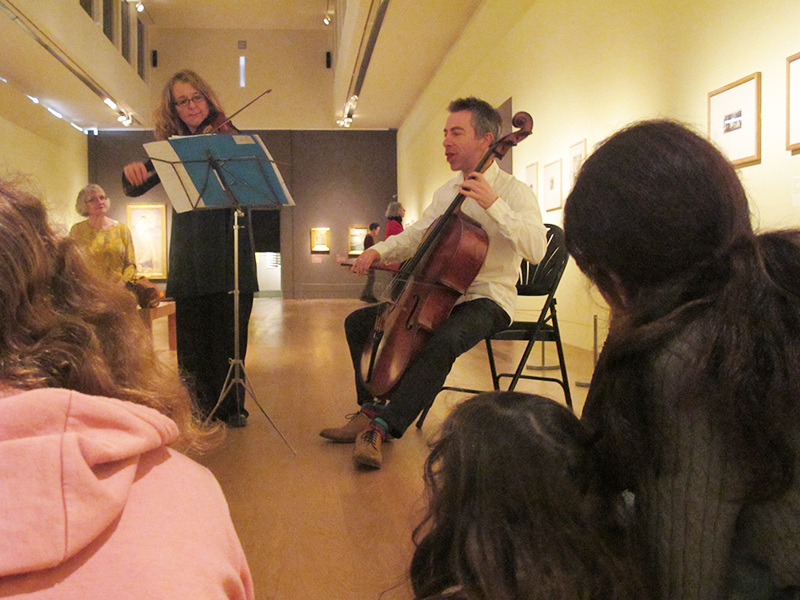 musicians perform in the exhibitions gallery