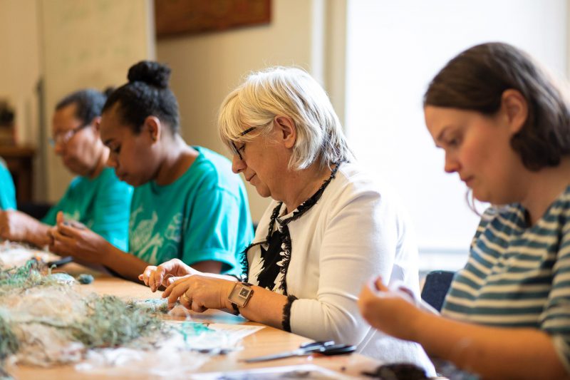 Participants and artists make tiny ghost net turtles