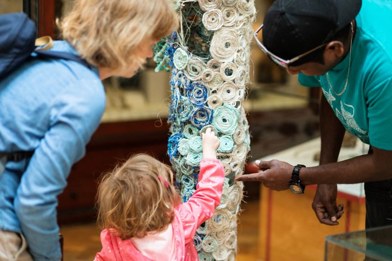 Small girl pointing to the Barry the Barracuda sculpture