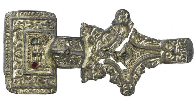 Z 7106 A. Square headed brooch set with garnets and decorated with "chip carved" zoomorphic ornament in Salin’s style I.