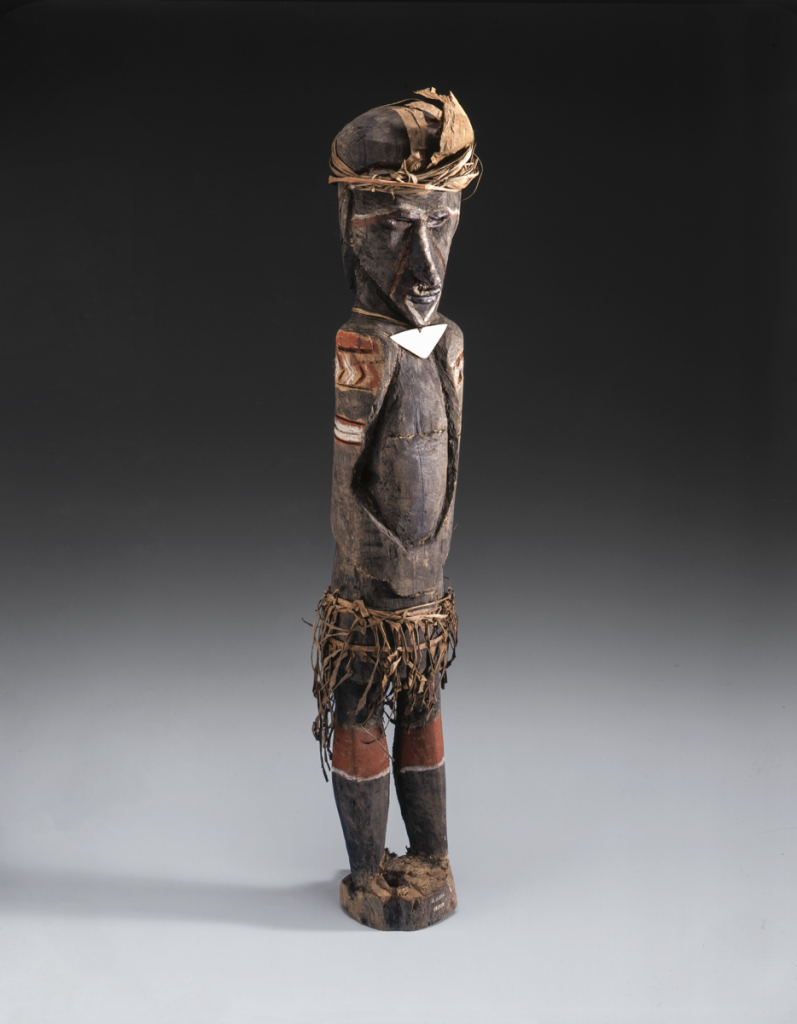 Carved wooden model of a figure (madub) placed in the garden to encourage good crops. 