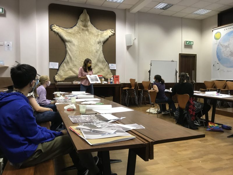 Students in large lecture theatre at the Polar Museum