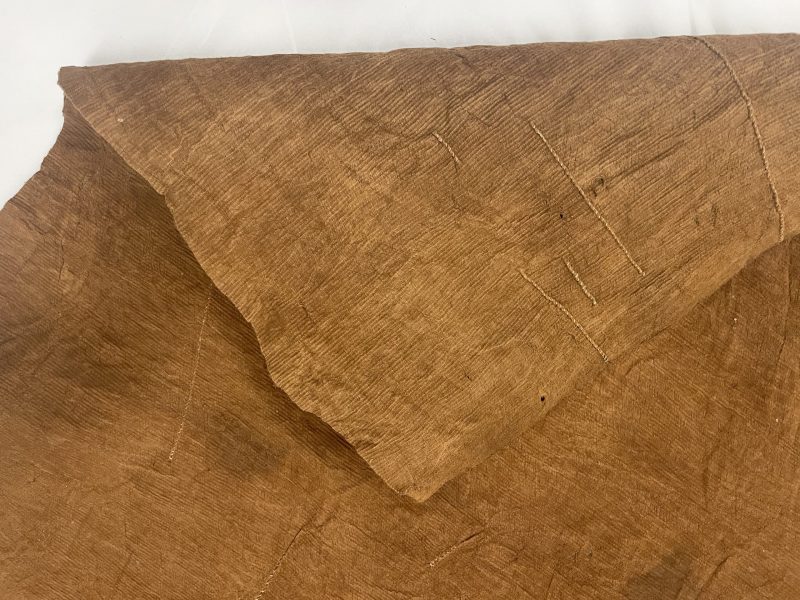 Image of same barkcloth (above) showing 'raised scar' stitching on the reverse side.