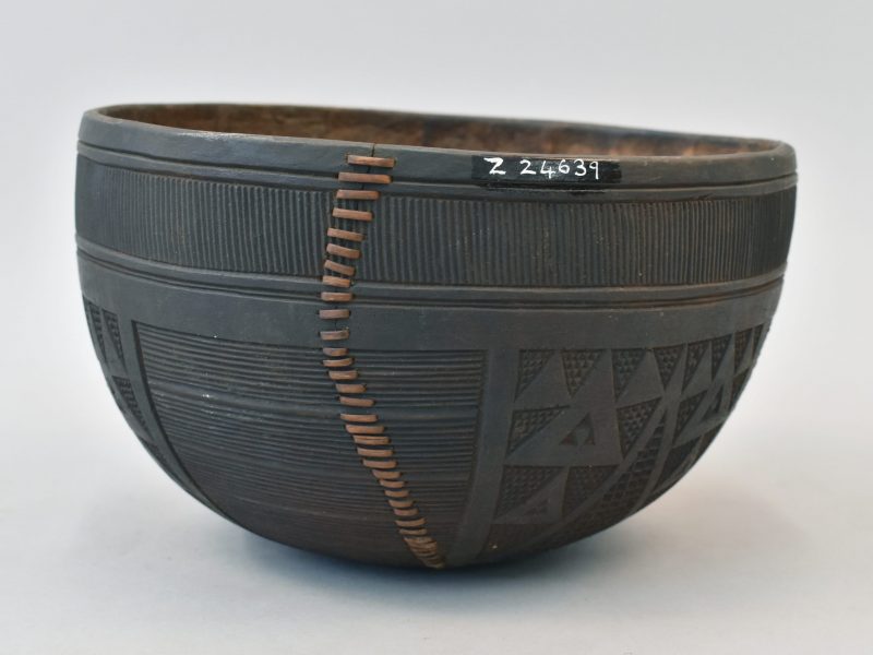 Decorative gourd from South Nigeria showing large crack repaired with cane whipstitch.