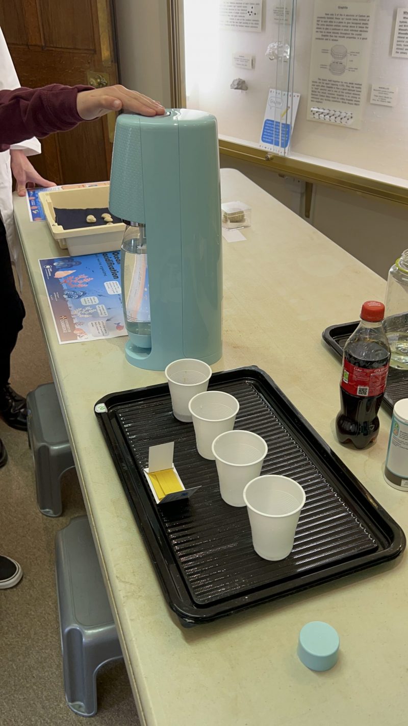 Visitors learn about the acidic effects of CO2 gas on our oceans by using a SodaStream machine. 