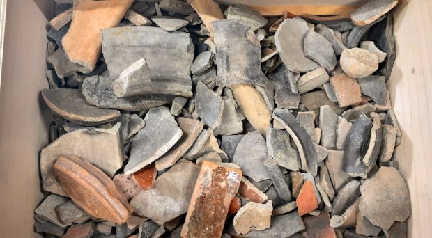 A box full of unsorted Roman and Post Medieval pottery, prior to processing by Stores Move team