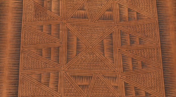 Square piece of red-brown Ugandan barkcloth decorated on the front with black pigment