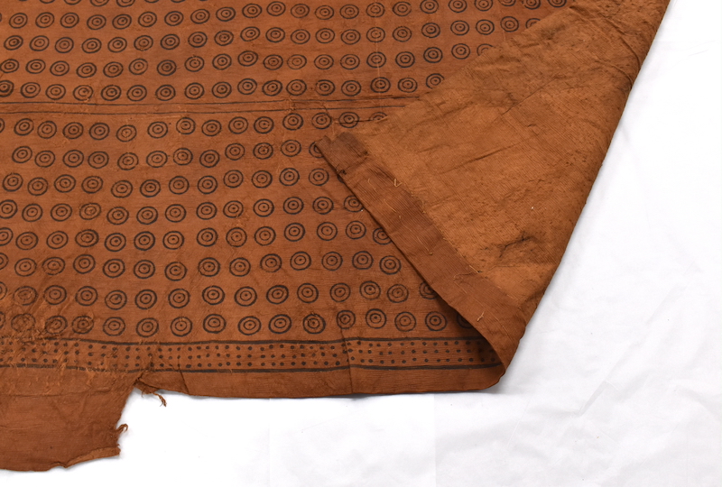 Close up of patterned barkcloth showing hemmed detail on the reverse.