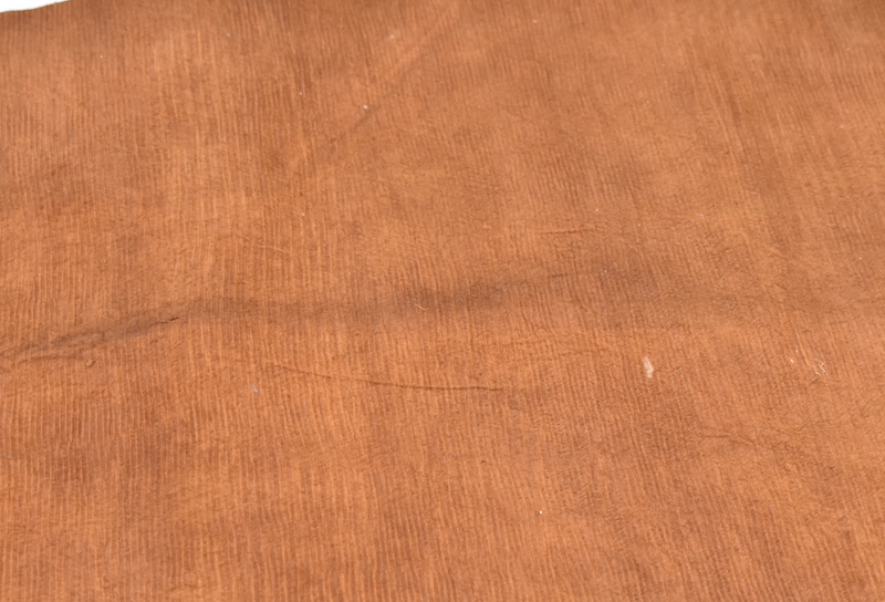 A close up of an undecorated piece of barkcloth with visible beater marks