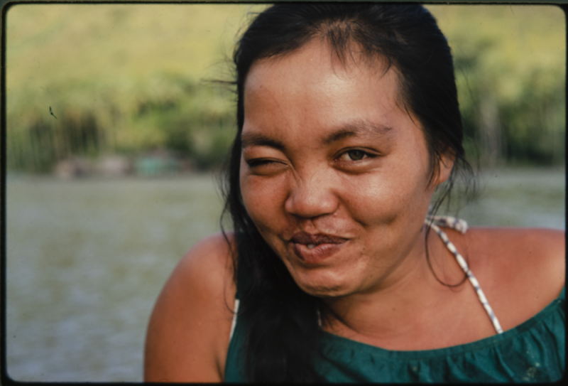 A woman looking into camera winking and smiling