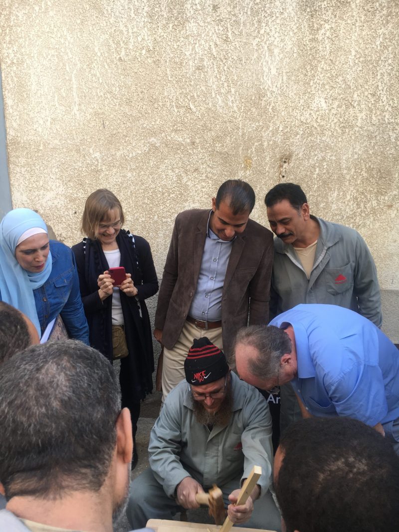 Pop Up Museum in Damietta, at Pinocchio Furniture Factory. Egyptian Museum in Cairo (EMC) curators and Dr Julie Dawson, Dr Geoffrey Killen of the Egyptian Coffins project showing the ancient Egyptian carpentry tools to workers at the factory who enthusiastically tried the tools and discussed similarities and differences to current tools.