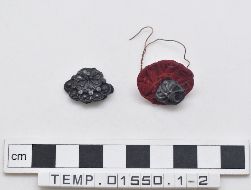 Two fragments with metal ornaments