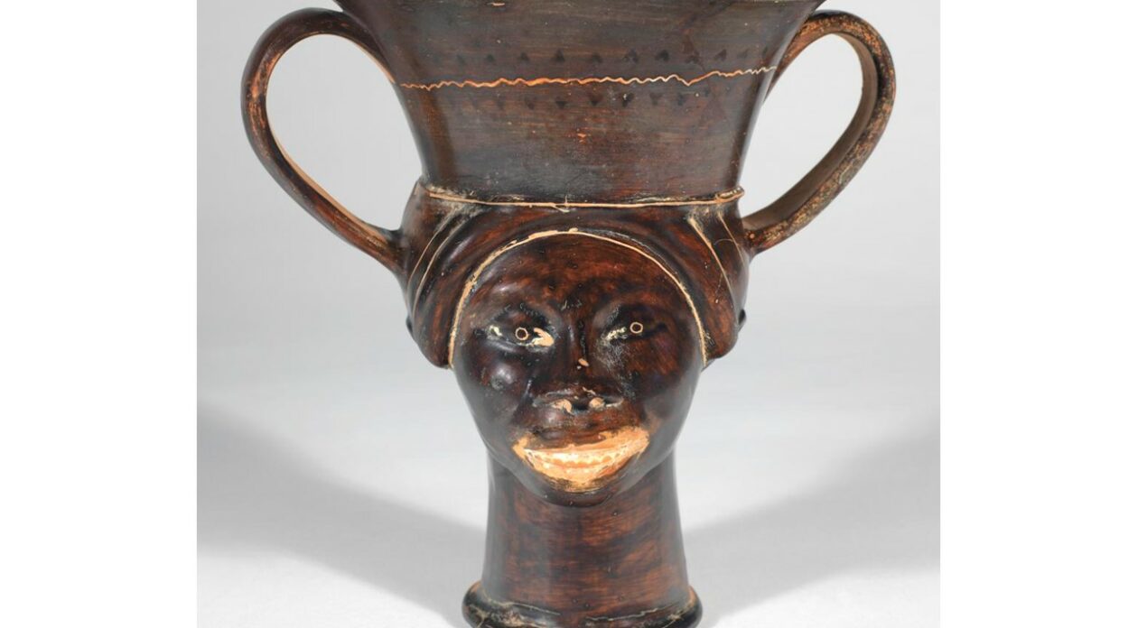 Greek vase showing face of a Black woman