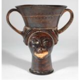 Greek vase showing face of a Black woman