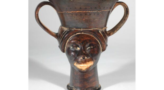 Greek vase showing face of a Black woman