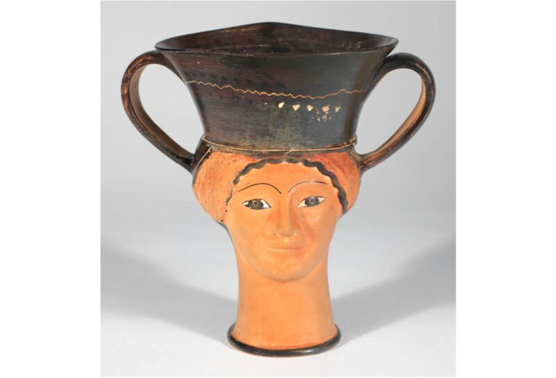 Greek vase showing face of a white woman