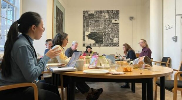 Group of researchers carrying out an online word-search in the Museum's archives