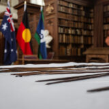 The Gweagal spears presented on a table at the ceremony in the Wren Library.