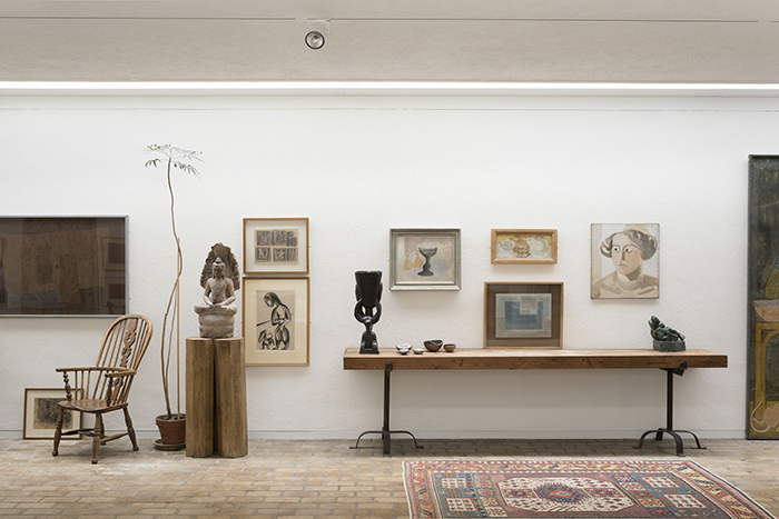 a view of part of the house at Kettle's Yard showing Nicholson's painting displayed amongst some of his other works