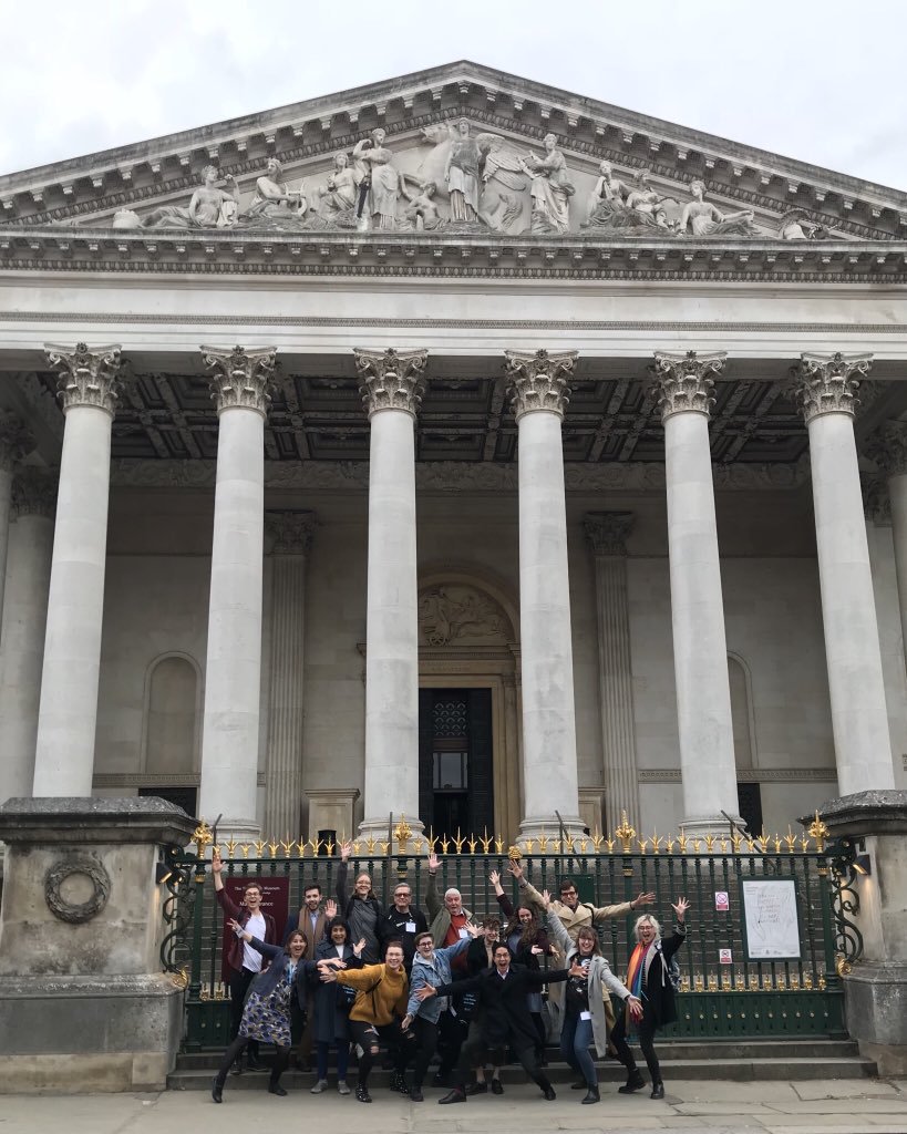 The Bridging Binaries guides celebrate the completion of their training on the steps of the Fitzwilliam Museum