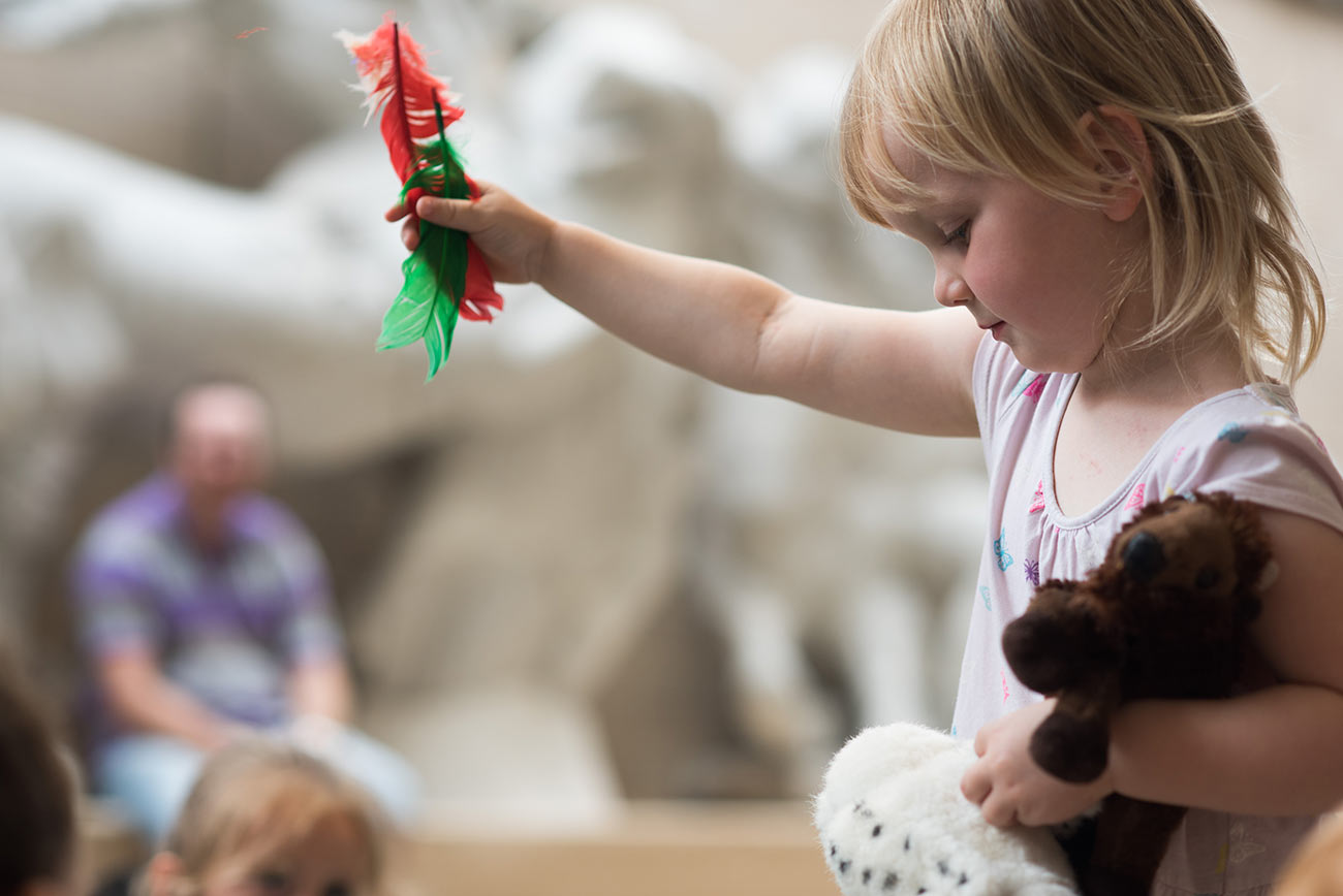 A child at a story telling event during summer at the museum