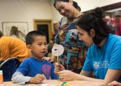 Child taking part in an activity at the Whipple Museum