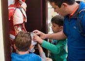 Children exploring an object at the Whipple Museum