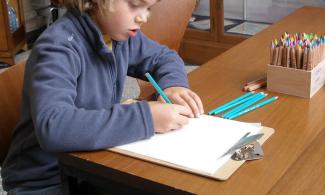 Child drawing in gallery