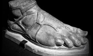 Plaster cast of foot wearing Greek sandal