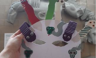 Paper mask with snakes