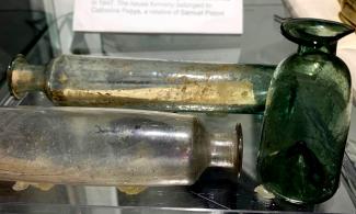Selection of witch's bottles in a display case