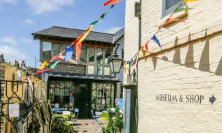 Image of museum exterior with coloured bunting
