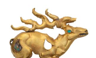 golden stag with inlays of turquoise and lapis lazuli