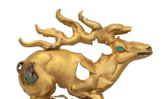golden stag with inlays of turquoise and lapis lazuli