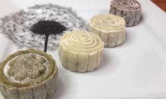 Four mooncakes laid out on a plate