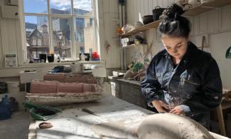 artist working in her studio