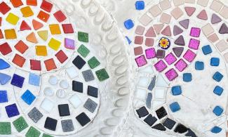 White clay plaques decorated with mosaic tiles