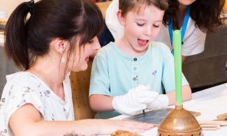 Child taking part in a workshop at the Museum
