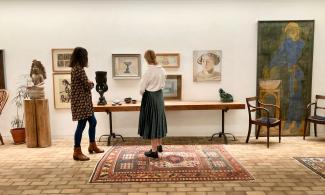 two students looking at artwork in the Kettle's Yard House