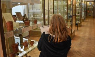 An image of a child drawing in the Fitzwilliam Museum galleries